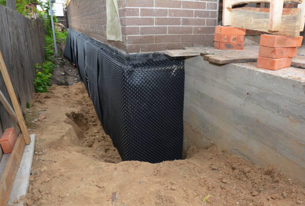 Happy homeowners after waterproofing job in Washington Grove